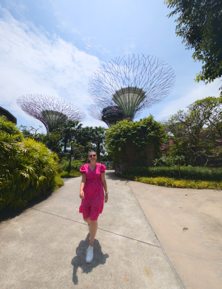 I&B's Founder posing in front of the Supertree Grove in Gardens by the Bay in Singapore.