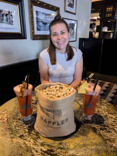 I&B's Founder at Raffles Hotel in Singapore with a famous Singapore Sling