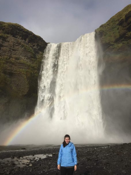 I&B's Founder posing in front of the Skógafoss waterfall in Iceland