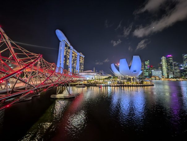 Singapore skyline at night, featuring Marina Bay Sands and the ArtScience Museum.